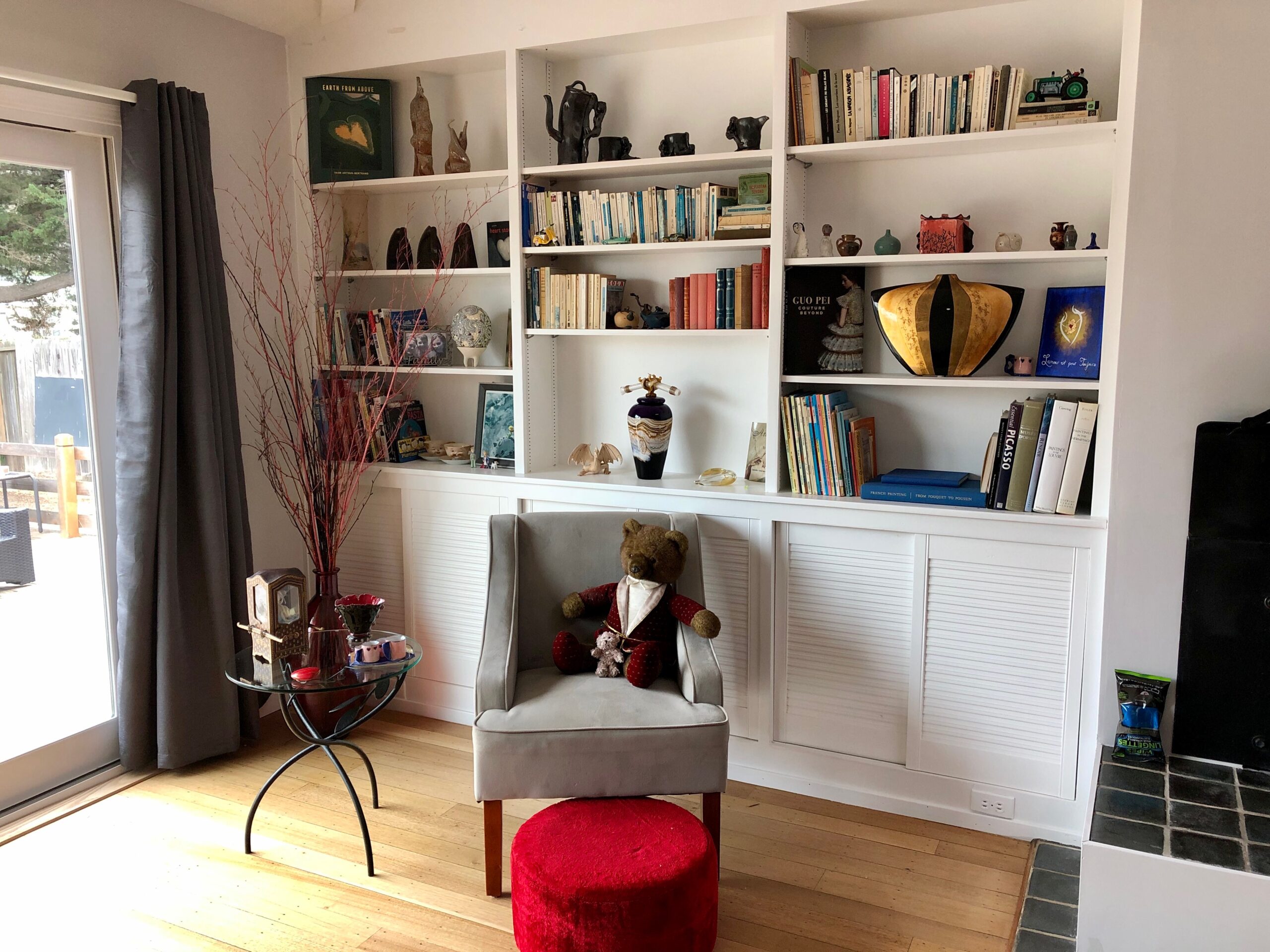 built in bookcase by window and reading corner