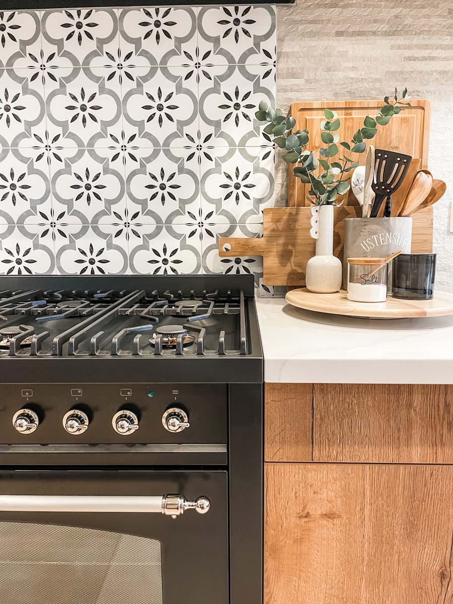 Kitchen utensil and cutting board by oven