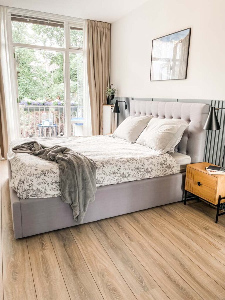 Bedroom with door leading to balcony 