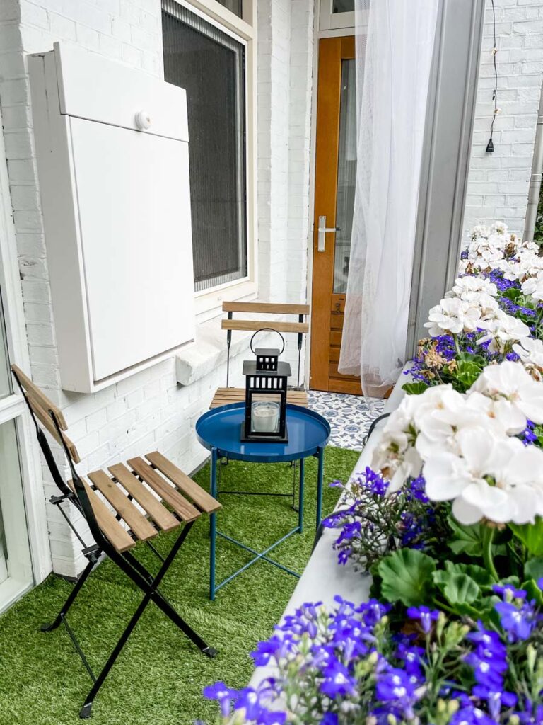 Balcony seating overlooking hanging flowers