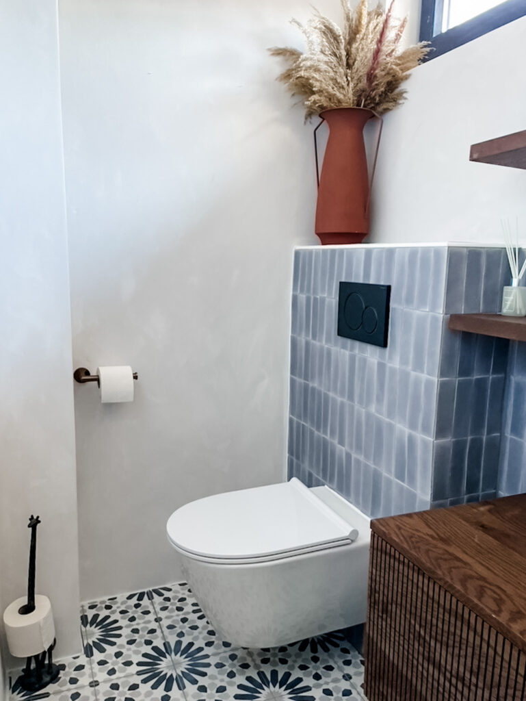 limewash bathroom and blue tiles