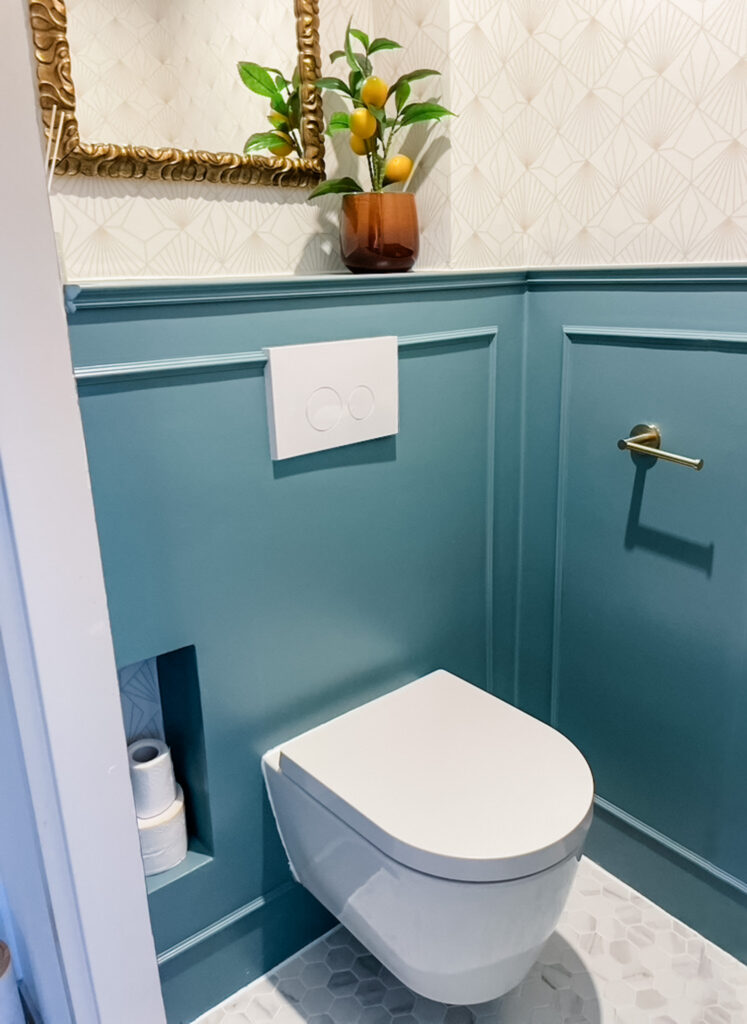 Blue and gold bathroom remodel with crown molding