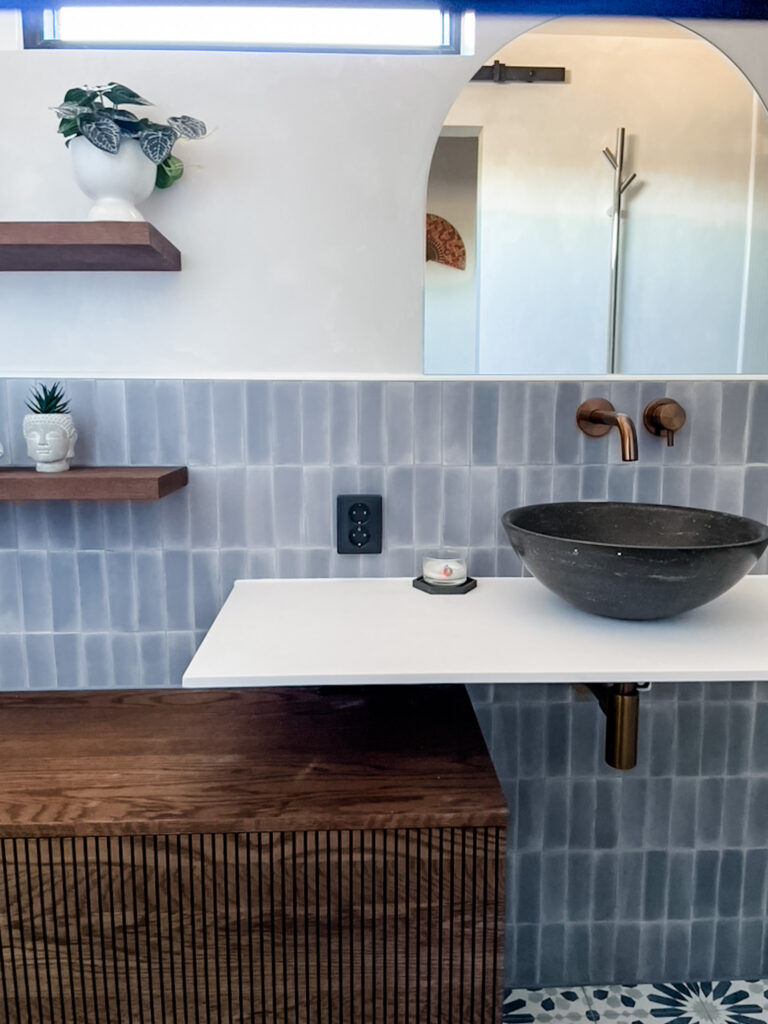 floating vanity and vessel sink in bathroom